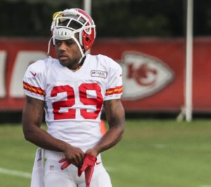Aug. 3, 2015; St. Joseph, MO; Chiefs safety Eric Berry puts on his gloves before training camp practice at Missouri Western State University (Emily DeShazer/The Topeka Capital-Journal)