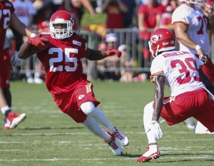 Aug. 2, 2014; St. Joseph, MO: Chiefs running back Jamaal Charles (25) runs through a gap in the line while avoiding safety Husain Abdullah (39) during a drill at training camp at Missouri Western State University. (Emily DeShazer/ The Topeka Capital-Journal)