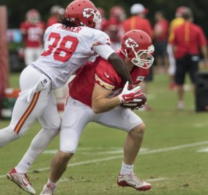 Aug. 18, 2015; St. Joseph, MO: Chiefs tight end Adam Schiltz catches a pass as defensive back Ron Parker defends during training camp at Missouri Western State University in St. Joseph, Mo. (Emily DeShazer/The Topeka Capital-Journal)