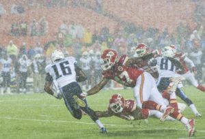 Aug. 28, 2015; Kansas City, MO; Chiefs linebacker Ja'Gared Davis (47) and running back Darrin Reaves (32) attempt to tackle Tennessee Titans wide receiver Tre McBride during the preseason game against the Tennessee Titans at Arrowhead Stadium on Friday. The game was called due to the weather with 3:50 remaining in the game because of the weather. (Emily DeShazer/The Topeka Capital-Journal)