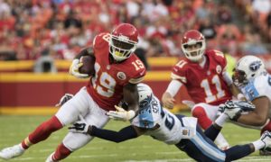 Aug. 28, 2015; Kansas City, MO: Chiefs wide receiver Jeremy Maclin is tackled by Titans cornerback Coty Sensabaugh during the preseason game against the Tennessee Titans at Arrowhead Stadium. (Emily DeShazer/The Topeka Capital-Journal)