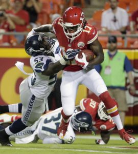 Aug. 21, 2015; Kansas City, MO; Seattle Seahawks linebacker Tyrell Adams (53) attempts to tackle Chiefs wide receiver Chris Conley (17) during a preseason game at Arrowhead Stadium. (AP Photo/Charlie Riedel)