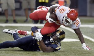 Sept. 3, 2015; St. Louis; Chiefs running back Darrin Reaves gains yards before being brought down by St. Louis Rams outside linebacker Alec Ogletree during the preseason finale at the Edward Jones Dome. (AP Photo/L.G. Patterson)