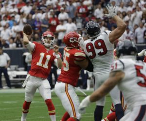 Sept. 13, 2015; Houston; Chiefs right tackle Jah Reid (75) blocks Texans defensive end J.J. Watt as quarterback Alex Smith (11) sets to make a pass during the first half at NRG Stadium. (AP Photo/David J. Phillip)