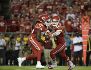 Sept. 17, 2015; Kansas City, MO: Chiefs quarterback Alex Smith (11) hands off the ball to running back Jamaal Charles (25) against the Denver Broncos at Arrowhead Stadium. (AP Photo/Charlie Riedel)