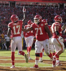 Oct. 25, 2015; Kansas City, MO; Chiefs right tackle Jeff Allen (71) congratulates wide receiver Chris Conley (17) after Conley scored a touchdown against the Pittsburgh Steelers at Arrowhead Stadium. (AP Photo/Charlie Riedel)