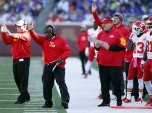 Oct. 18, 2015; Minneapolis; Chiefs coaches, Tom Melvin (left) and Eric Bieniemy (center), signal to players on the field as head coach Andy Reid observes against the Vikings at TCF Bank Stadium. (AP Photo/Jim Mone)