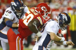Sept. 17, 2015; Kansas City, MO; Chiefs linebacker Justin Houston (18) sacks Denver Broncos quarterback Peyton Manning (18) at Arrowhead Stadium. (Chris Neal/The Topeka Capital-Journal)