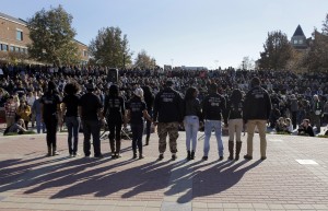 Nov. 9, 2015; Columbia, MO; Members of black student protest group Concerned Student 1950 hold hands following the announcement that University of Missouri system president Tim Wolfe would resign. (AP Photo/Jeff Roberson)