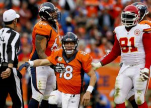 Nov. 15, 2015; Denver; Broncos offensive lineman Louis Vasquez helps Broncos quarterback Peyton Manning (18) get up after a sack against the Chiefs at Sports Authority Field at Mile High. (AP Photo/Joe Mahoney)