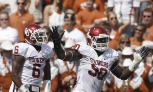 Oct. 8, 2011; Dallas; Then-Oklahoma defensive end David King (90) celebrates after returning a fumble for a touchdown against Texas. (AP Photo/Brandon Wade)