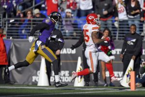 Dec. 20, 2015; Baltimore; Kansas City Chiefs running back Charcandrick West (35) scores a touchdown in front of Ravens cornerback Jimmy Smith in the first half at M&T Bank Stadium. (AP Photo/Nick Wass)