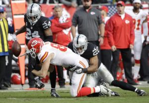 Dec. 6, 2015; Oakland; Kansas City Chiefs tight end Travis Kelce (87) loses a fumble as he is tackled by Raiders defensive back Nate Allen (20) at O.co Coliseum. (AP Photo/Marcio Jose Sanchez)