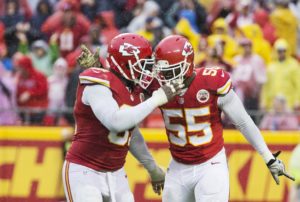 Dec. 13, 2015; Kansas City, MO; Chiefs linebackers Dee Ford (55) and Tamba Hali (91) celebrate after Ford sacked San Diego Chargers quarterback Philip Rivers at Arrowhead Stadium. (Emily DeShazer/The Topeka Capital-Journal)
