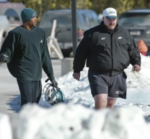 Jan. 27, 2005; Philadelphia; Then-Eagles wide receiver Todd Pinkston (left) and Andy Reid (right) walk past snowbanks to a heated practice field for preparations for Super Bowl XXXIX. (AP Photo/George Widman)