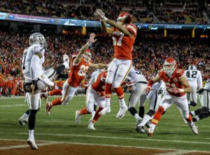 Jan. 3, 2016; Kansas City, MO; Chiefs linebacker D.J. Alexander (57) blocks a punt by Oakland Raiders punter Marquette King (7) for a safety during the second half at Arrowhead Stadium. (AP Photo/Reed Hoffmann)