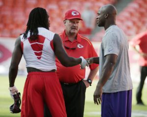 Aug. 23, 2014; Kansas City, MO; Brad Childress (center) with Chiefs running back Jamaal Charles (left) and Minnesota Vikings running back Adrian Peterson (right) before a preseason game at Arrowhead Stadium. (AP Photo/Charlie Riedel)
