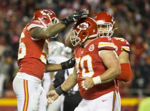 Jan. 3, 2016; Kansas City, MO; Chiefs defensive players celebrate after a Mike DeVito (70) sack against the Oakland Raiders at Arrowhead Stadium. (Emily DeShazer/The Topeka Capital-Journal)