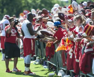 Aug. 3, 2015; St. Joseph, MO; Chiefs linebacker Justin Houston signs autographs after a training camp practice at Missouri Western State University. (Emily DeShazer/The Topeka Capital-Journal)
