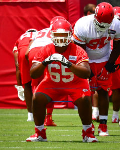 June 14, 2016; Kansas City, MO; Chiefs rookie guard Garrick Mayweather (65) stretches during minicamp at the team's training facility. (Rex Wolf/The Topeka Capital-Journal)