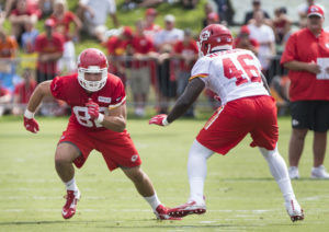 Tight end Ross Travis (82) begins his route lined up against safety Akeem Davis during the first day of training camp Saturday, July 30 in St. Joseph, Mo. (Emily DeShazer/The Topeka Capital-Journal)