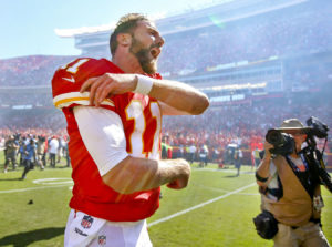 Kansas City's Alex Smith yells in celebration after running in the game winning touchdown in overtime to defeat the San Diego Charger, 33-27, Sunday afternoon at Arrowhead. (Chris Neal/The Topeka Capital-Journal)