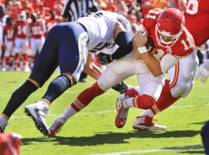 Kansas City's Alex Smith, right, gets hit by San Diego's Williams Tourek before falling into the end zone for the game winning touchdown in overtime of Sunday afternoon's game at Arrowhead Stadium. (Chris Neal/The Topeka Capital-Journal)