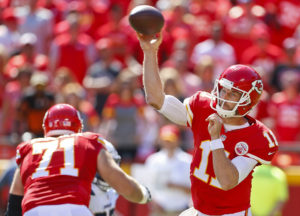 Kansas City's Alex Smith, right, throws downfield during the second half of Sunday afternoon's overtime win over the Chargers, 33-27, at Arrowhead Stadium on Sept. 11, 2016. (Chris Neal/The Topeka Capital-Journal)