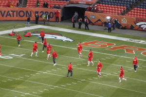 The Kansas City Chiefs take part in pregame warmups before their game against the Denver Broncos at Sports Authority Field at Mile High. (Photo by Matt Derrick, ChiefsDigest.com)