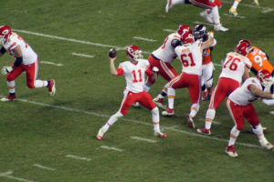 Kansas City Chiefs quarterback Alex Smith delivers a pass late in the fourth quarter during the team's stunning 30-27 overtime win over the Denver Broncos at Sports Authority Field at Mile High on Nov. 27, 2016. (Photo by Matt Derrick, ChiefsDigest.com)