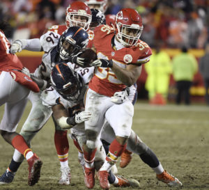 Kansas City Chiefs running back Charcandrick West fights for yardage in the team's 33-10 win over the Denver Broncos at Arrowhead Stadium Dec. 25, 2016. (Photo by Mike Gunnoe/The Topeka-Capital Journal)