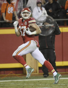 Kansas City Chiefs tight end Travis Kelce looks back as he races for a touchdown on an 80-yard reception during the team's 33-10 win over the Denver Broncos at Arrowhead Stadium on Dec. 25, 2016. (Photo by Mike Gunnoe, The Topeka-Capital Journal)