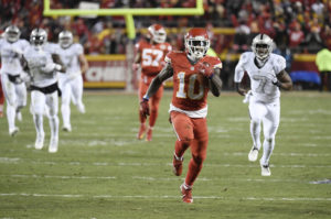 Kansas City Chiefs wide receiver Tyreek Hill races for a touchdown on a punt return during the second quarter of the team's 21-10 win over the Oakland Raiders Dec. 8, 2016.
