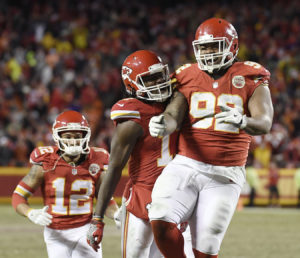 Kansas City Chiefs defensive tackle Dontari Poe (92) celebrates with wide receiver Chris Conley (17) after throwing a touchdown pass against the Denver Broncos in the team's 33-10 win Dec. 25, 2016. (Photo by Mike Gunnoe/The Topeka-Capital Journal)