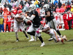 Oakland Raiders quarterback Derek Carr scans for a receiver during the Kansas City Chiefs' 26-10 win over the Raiders Oct. 16, 2016. (Photo courtesy Chiefs PR, Chiefs.com).