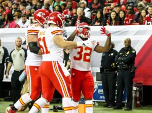 Kansas City Chiefs running back Spencer Ware (32) celebrates a touchdown with center Mitch Morse (61) and tackle Eric Fisher (72) during the first half of the team's game at the Atlanta Falcons Dec. 4, 2016. (Photo courtesy Chiefs PR, Chiefs.com)