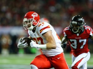 Kansas City Chiefs tight end Travis Kelce races Atlanta Falcons safety Ricardo Allen after making a catch during his team's 29-28 win at the Georgia Dome on Dec. 4, 2016. (Photo courtesy Chiefs PR, Chiefs.com)