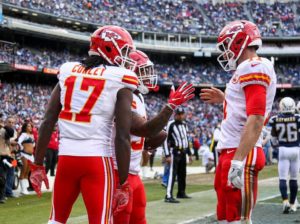 Running back Charcandrick West and quarterback Alex Smith celebrate with wide receiver Chris Conley following West's second touchdown of the game during the team's 37-27 win over the San Diego Chargers at Qualcomm Stadium on Jan. 1, 2017 (Photo courtesy Chiefs PR, Chiefs.com)