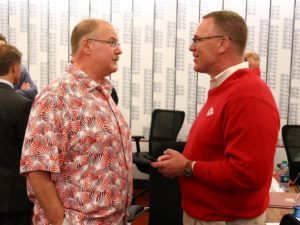 Chiefs coach Andy Reid (left) and general manager John Dorsey discuss the NFL draft during the first round on April 27, 2017.