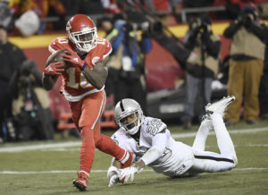 Kansas City Chiefs rookie Tyreek Hill outruns Oakland defensive back David Amerson during a 78-yard punt return for a touchdown during the team's win over the Oakland Raiders at Arrowhead Stadium Dec. 8, 2016. (Photo by Mike Gunnoe/The Topeka Capital-Journal)